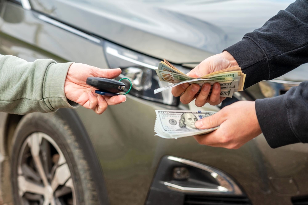 Eagle driver paying cash for a car at Calgary pickup